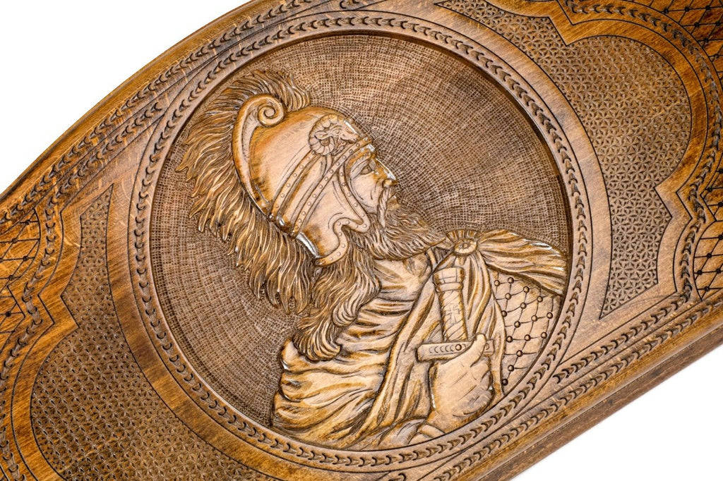 Detail view of the hand-carved commander relief on the solid wood exterior.