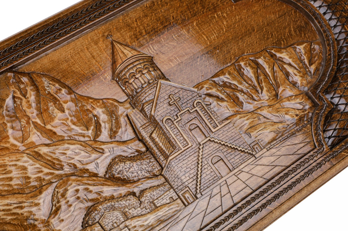 Frontal view of the hand-carved Noravank relief on the solid wood exterior.