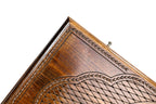 Corner of the lid: faceted lattice, rope border and lobed cartouche on the classic outline board