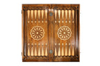 Open Armenian backgammon board 60 cm from above: dark field, pale points, wheel ornament on each half
