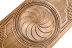 Frontal view of the relief-carved Armenian Eternity sign on solid wood.