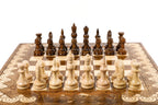 Handcrafted chess set with elegant carving and integrated backgammon board