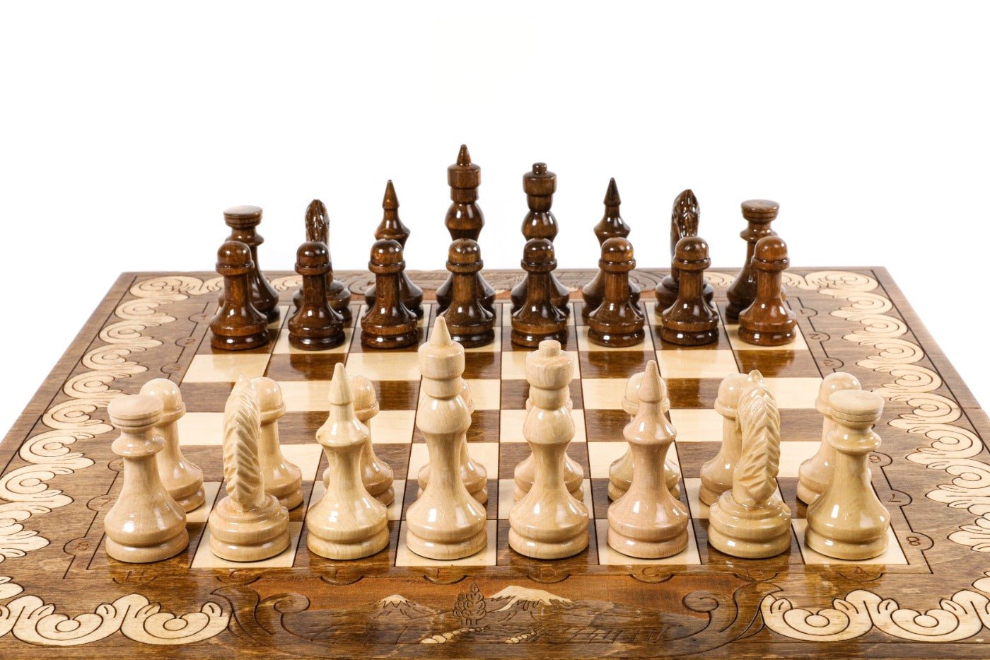 Handcrafted chess set with elegant carving and integrated backgammon board