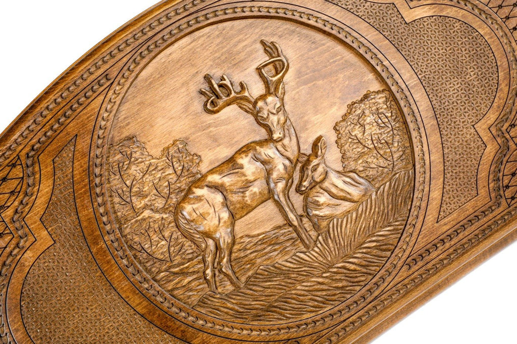 Frontal view of the graceful deer relief on the solid wood exterior.