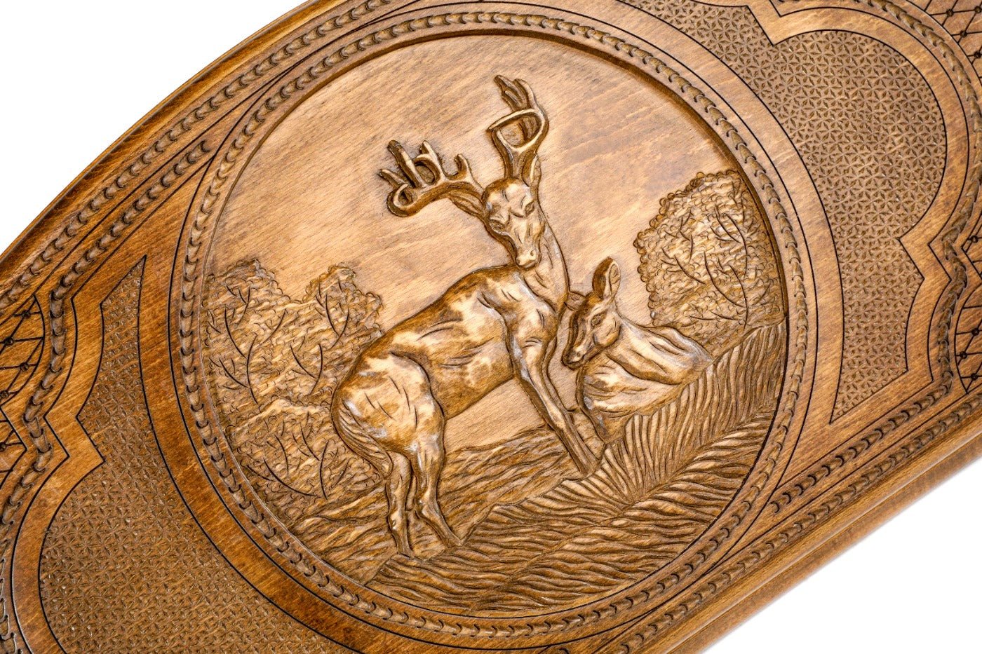 Frontal view of the graceful deer relief on the solid wood exterior.