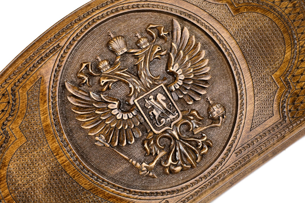 The interior of the open Hrachya Ohanyan Russian heraldry set highlighting the smooth wood grain and professional playing surface.