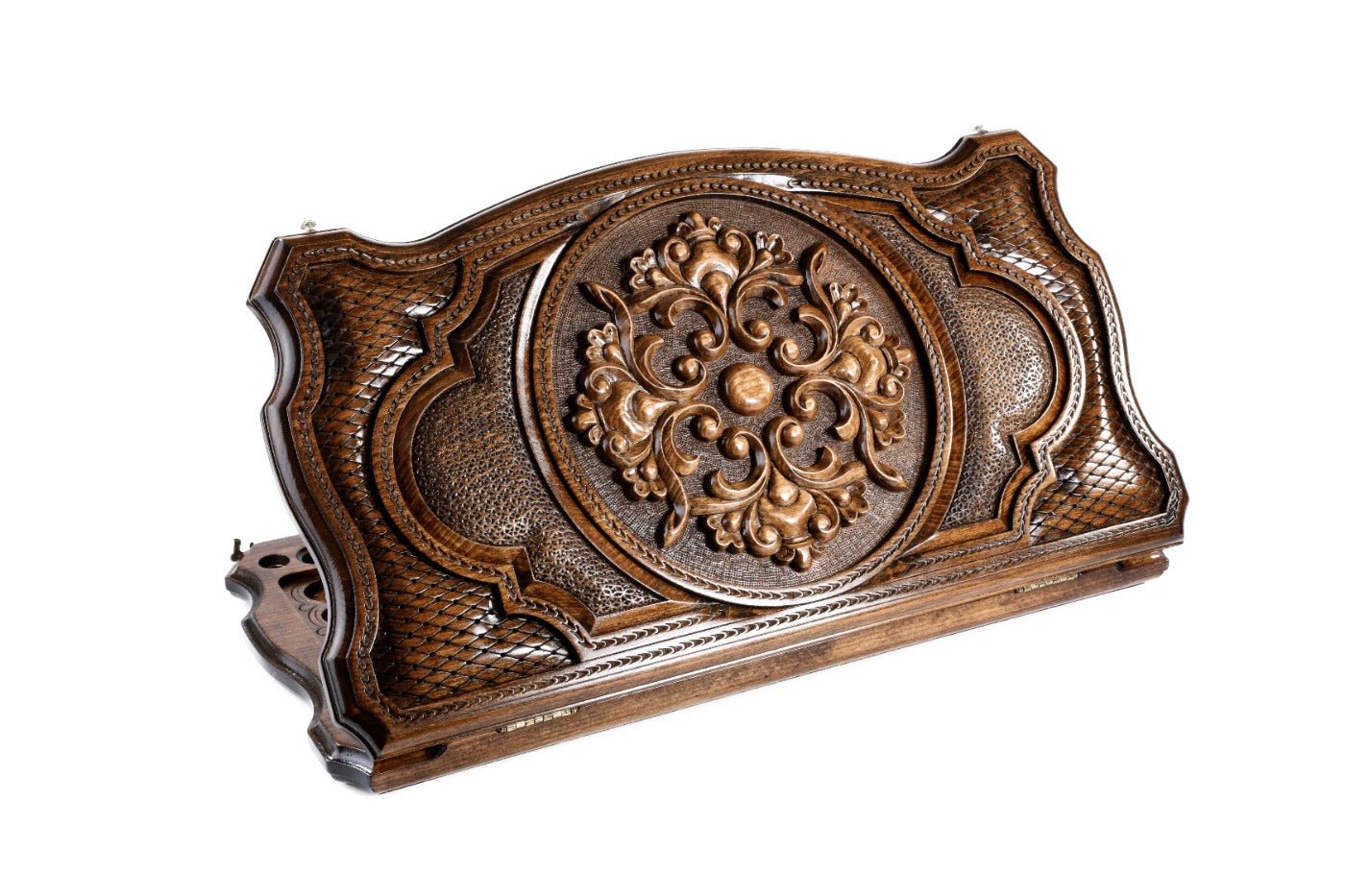 Closed Ornamental backgammon board with intricate carving and contour outline.