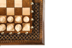 Corner detail of the deep-carved braid ornament and bronze coordinate studs with light pieces