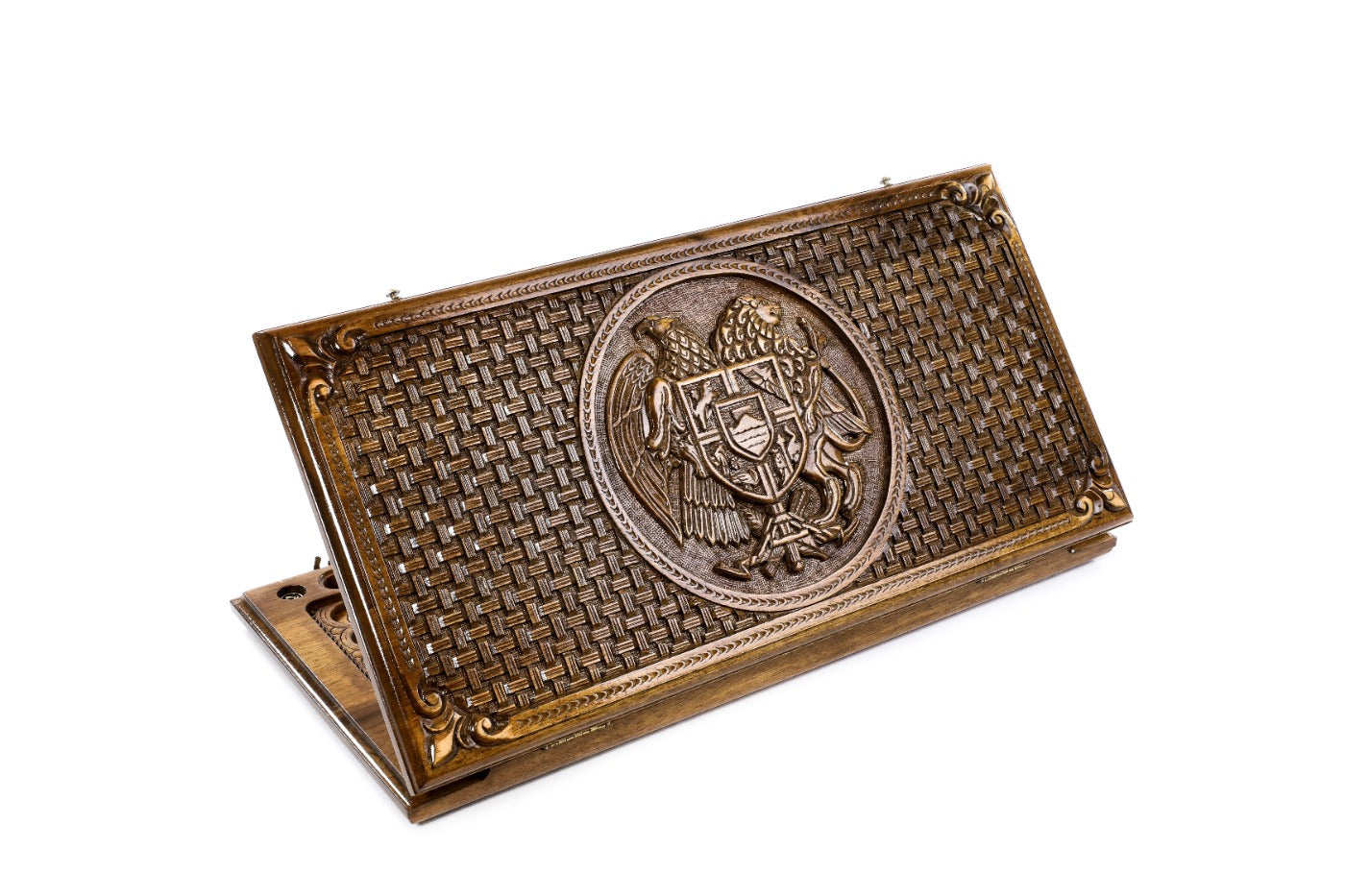 A frontal shot of the closed Armenian Coat of Arms backgammon board showing the detailed eagle and lion relief with wood incrustation.