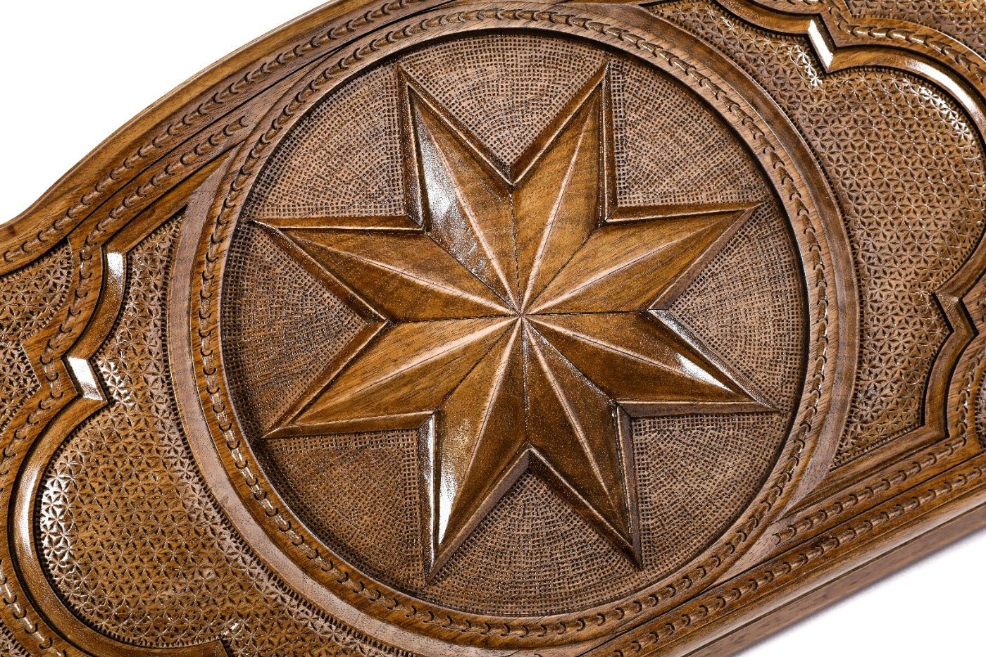 Detail view of the geometric Octagram relief on the solid wood exterior.