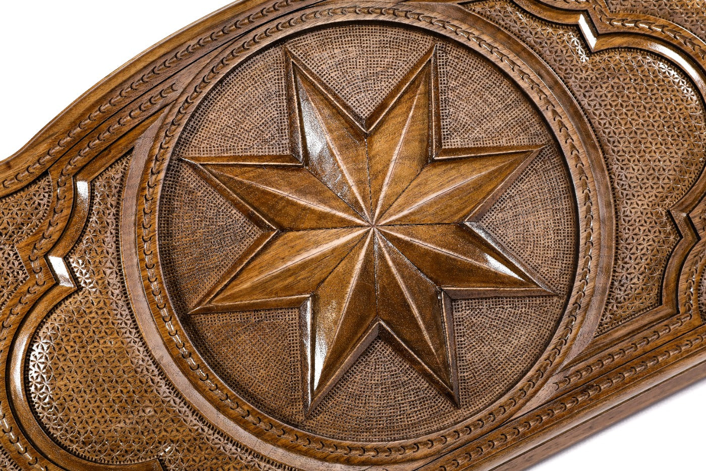 Detail view of the geometric Octagram relief on the solid wood exterior.