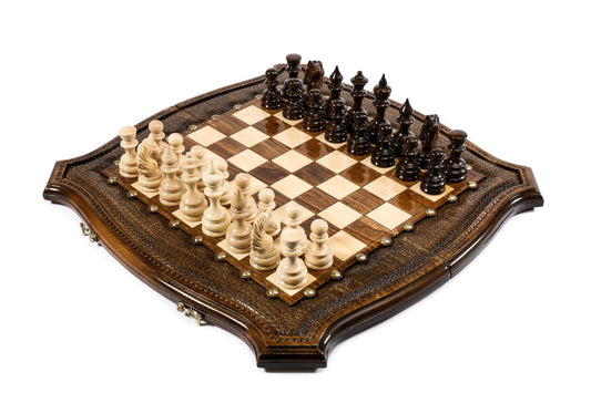 carved wooden chess set with contour outline and bronze details