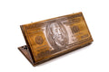 A frontal shot of the closed 100 Dollar Bill classic backgammon board showing the detailed Benjamin Franklin relief carving.