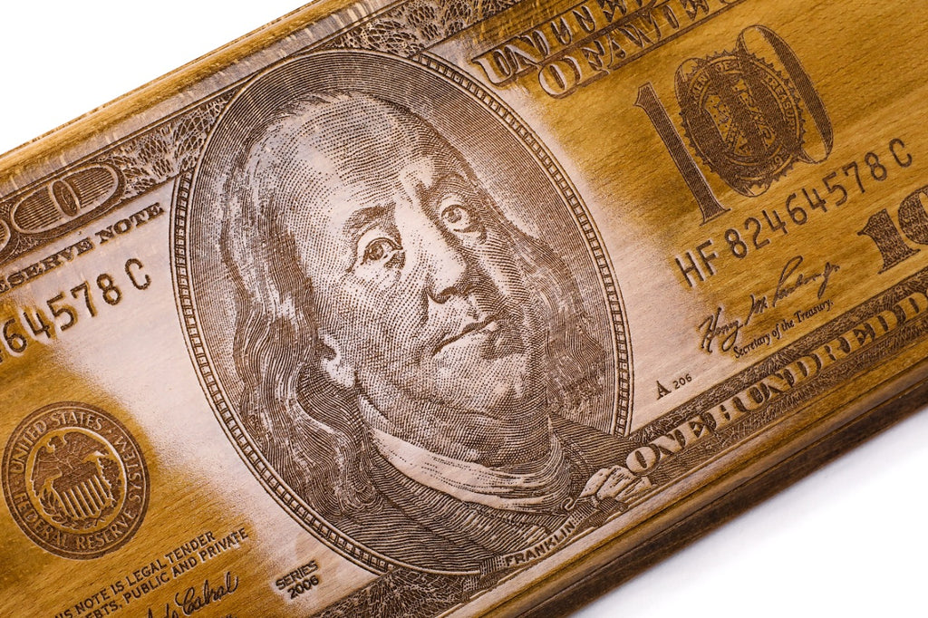 The interior view of the open Hrachya Ohanyan money-themed set highlighting the smooth wood finish and professional pips.