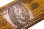 The interior view of the open Hrachya Ohanyan money-themed set highlighting the smooth wood finish and professional pips.