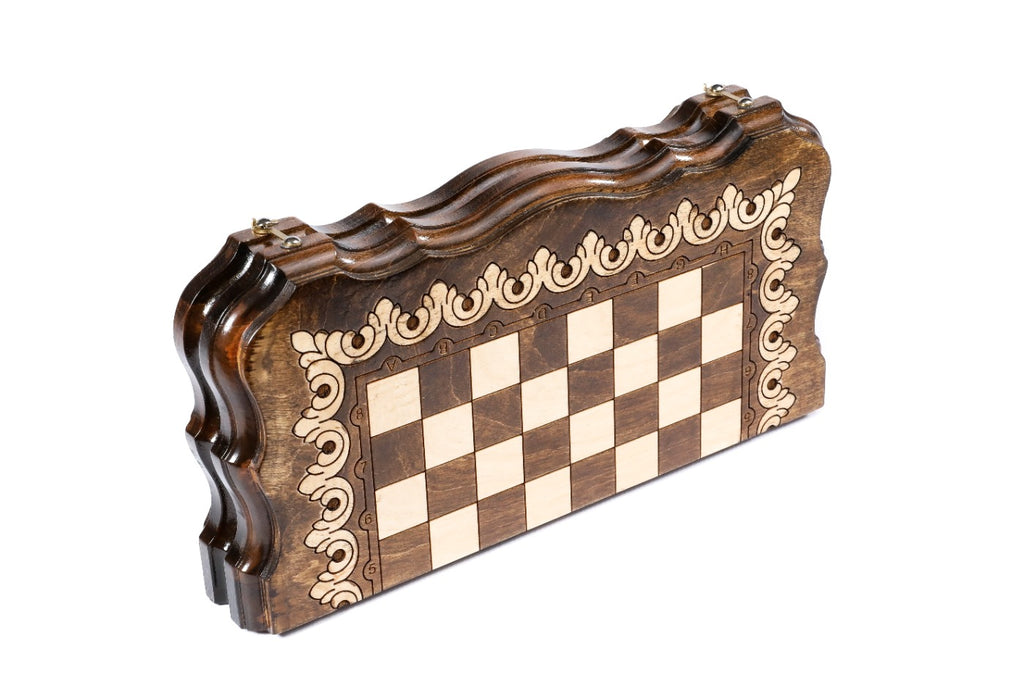 Closed 30 cm chess board standing on edge, scalloped contour outline with scroll ornament frame