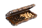 Travel chess and backgammon set half open, chess pieces stored inside on the backgammon field