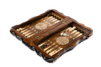 Portable chess backgammon set opened to the two-tone backgammon field with flower ornaments and dice