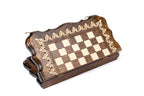 Closed wooden chess and backgammon board with scalloped edge and pale scroll ornament