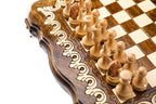 Light wooden chess pieces beside the two-tone scroll ornament of the scalloped frame
