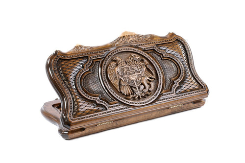 A frontal perspective of the closed wooden board showcasing the intricate heraldic carving of the Armenian Coat of Arms within the Ararat outline.