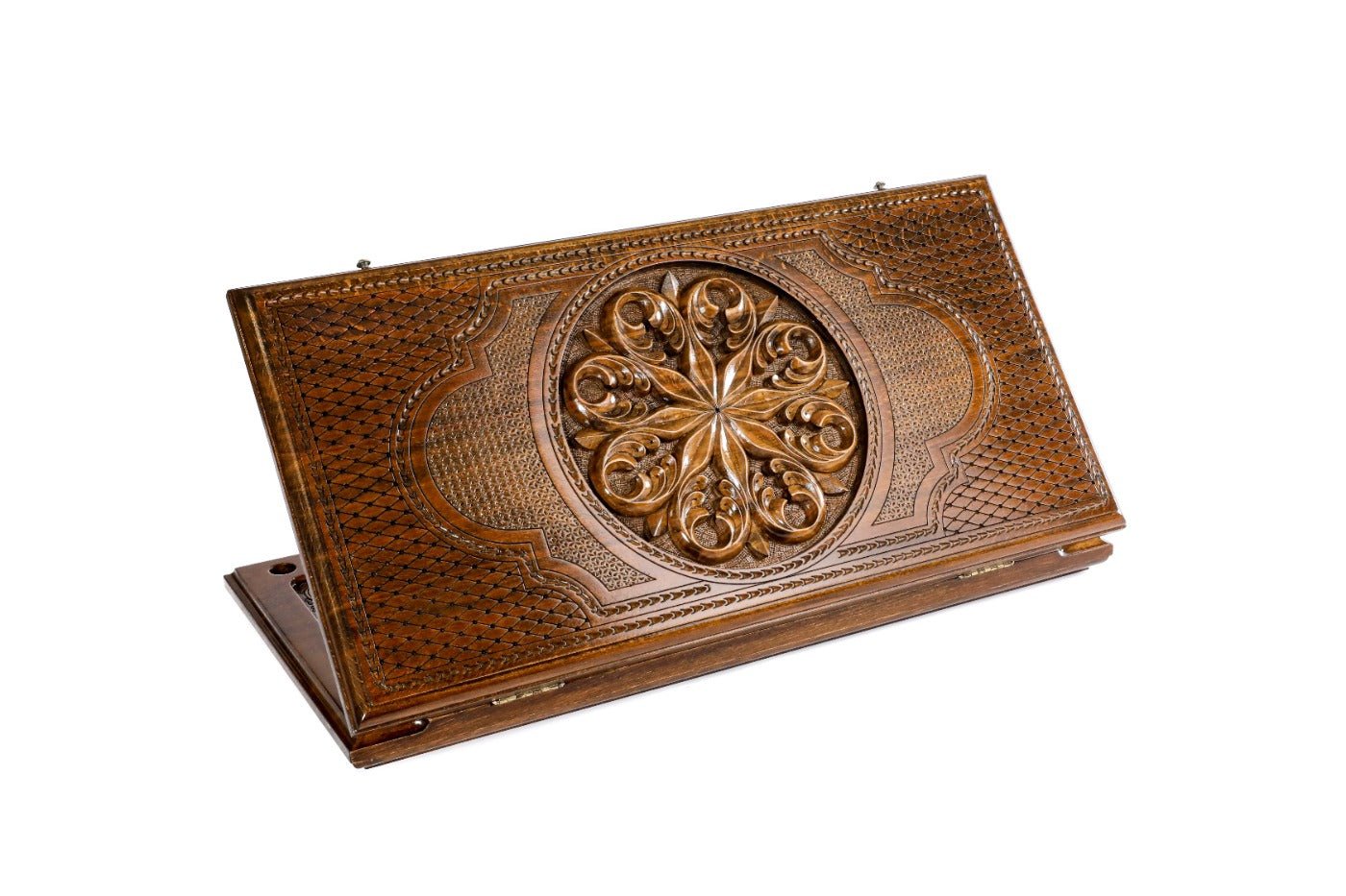 Closed Ornamental backgammon board with intricate hand-carved geometric patterns.