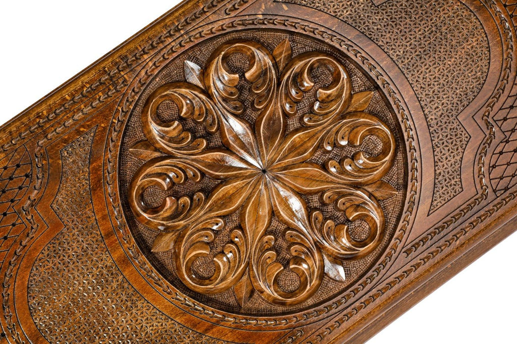 Frontal view of the detailed floral ornamental relief on the solid wood exterior.