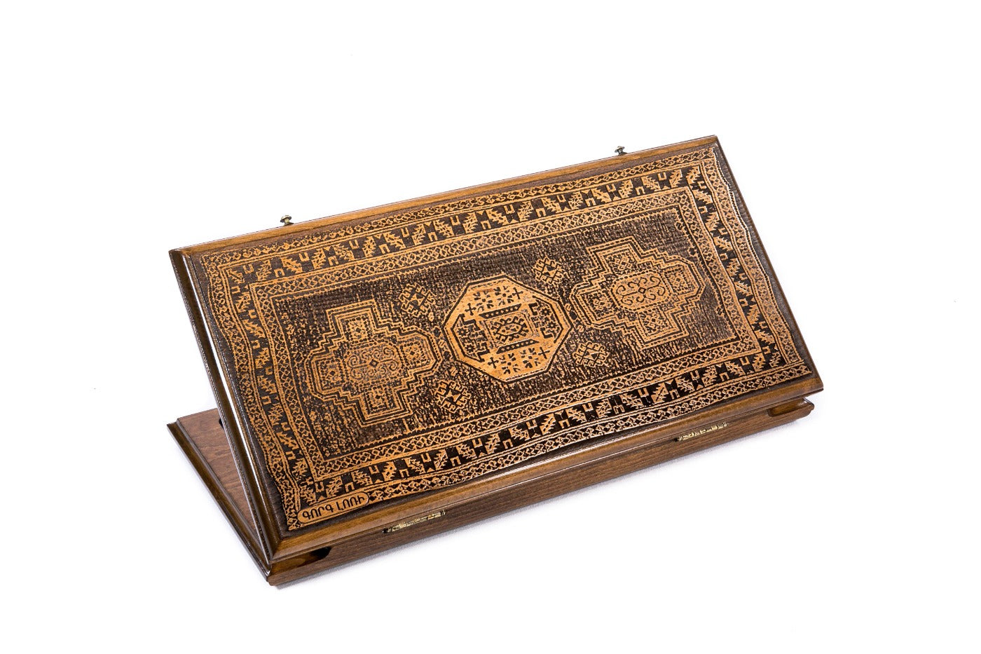 A frontal shot of the closed Lori Carpet classic backgammon board showing the detailed geometric rug relief carving.