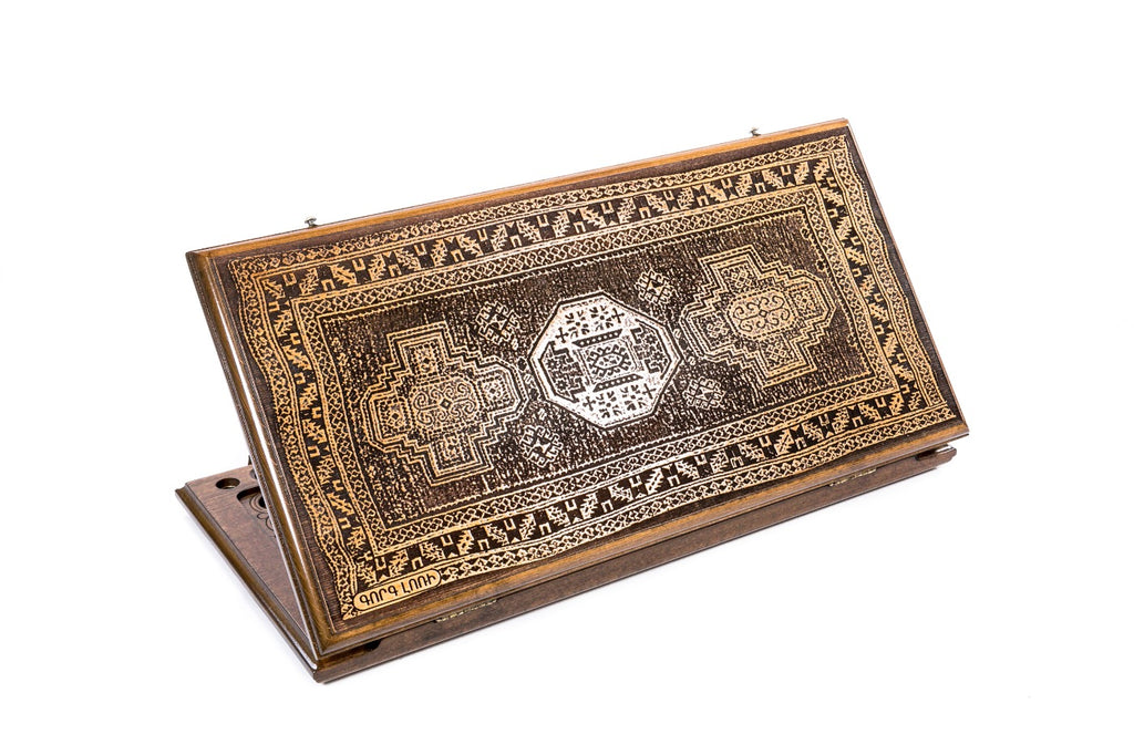 A frontal shot of the closed Lori Carpet classic backgammon board showing the detailed geometric rug relief carving.