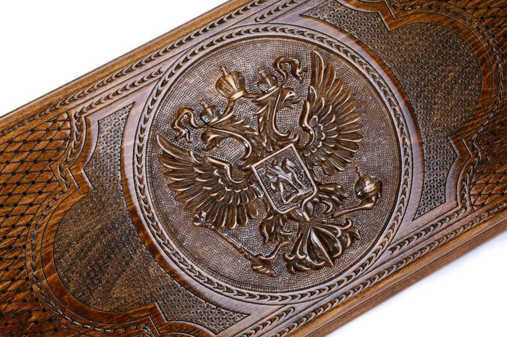 The interior view of the open Hrachya Ohanyan Russian emblem set highlighting the smooth wood finish and professional pips.