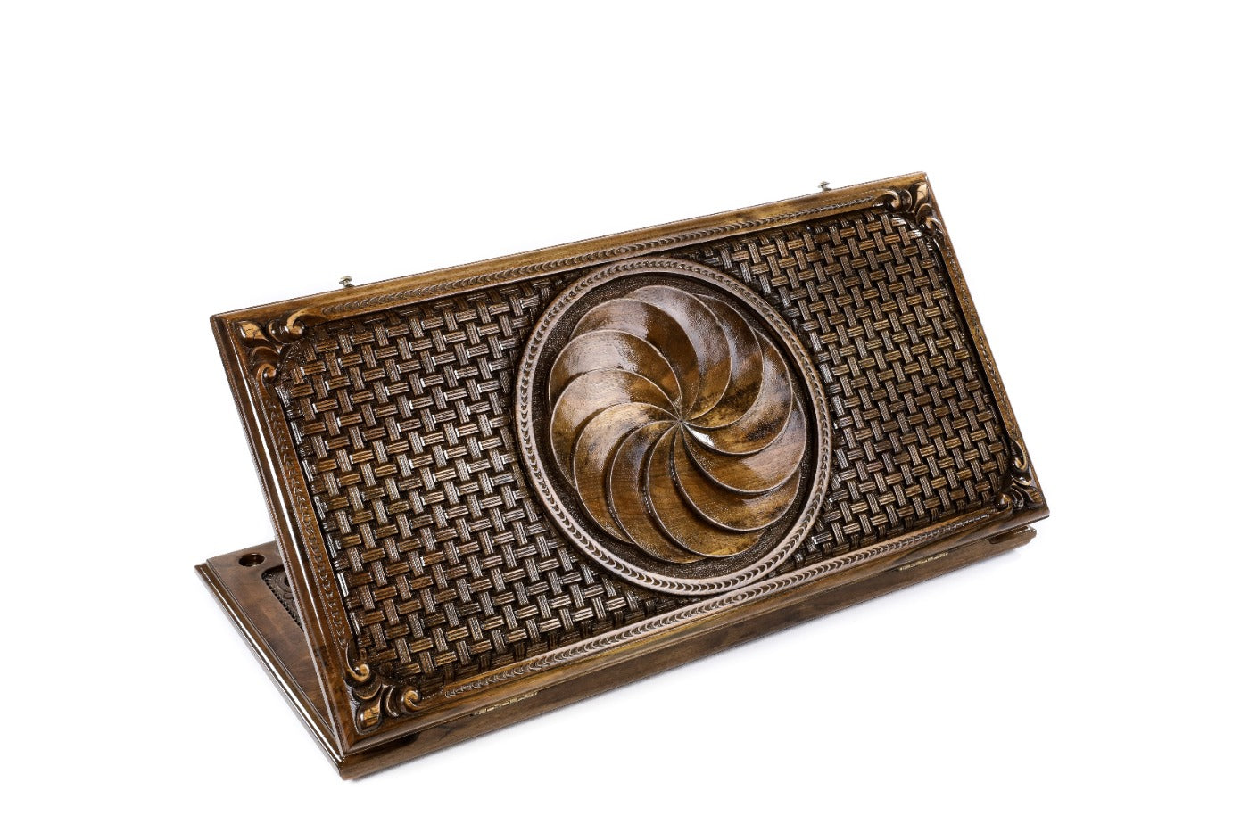 A frontal shot of the closed Eternity classic backgammon board showing the central Arevakhach relief and braided border.