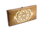Classic wooden backgammon board with handcrafted ornamental motif design