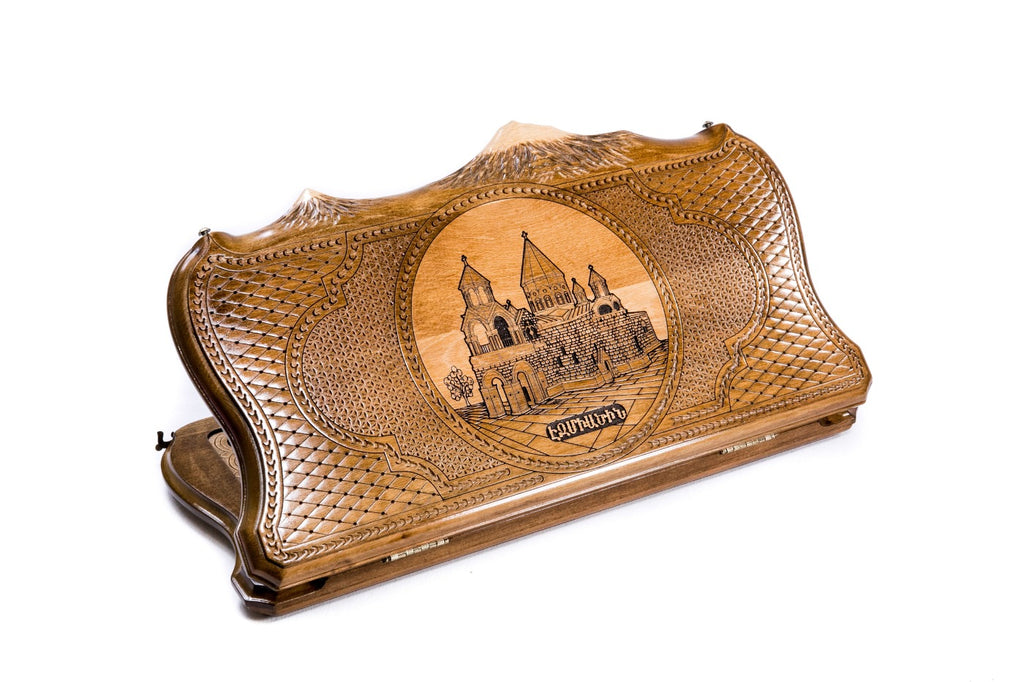 A frontal shot of the closed Etchmiadzin backgammon board featuring the cathedral relief carved inside the copyrighted Mount Ararat outline.