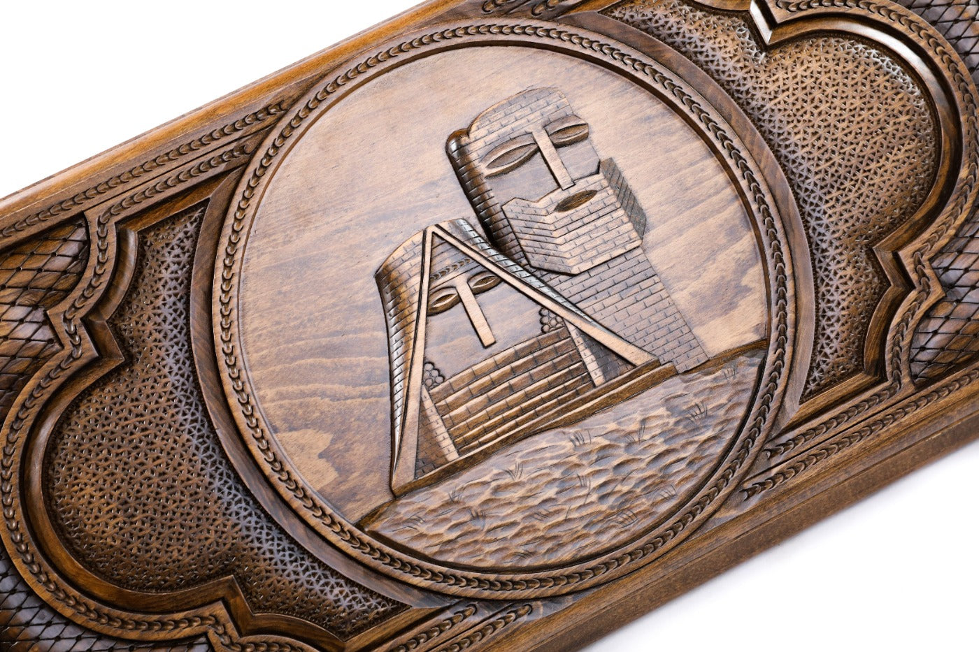 The reverse side of the two-sided Artsakh backgammon board showing the secondary ornamental hand-carvings.