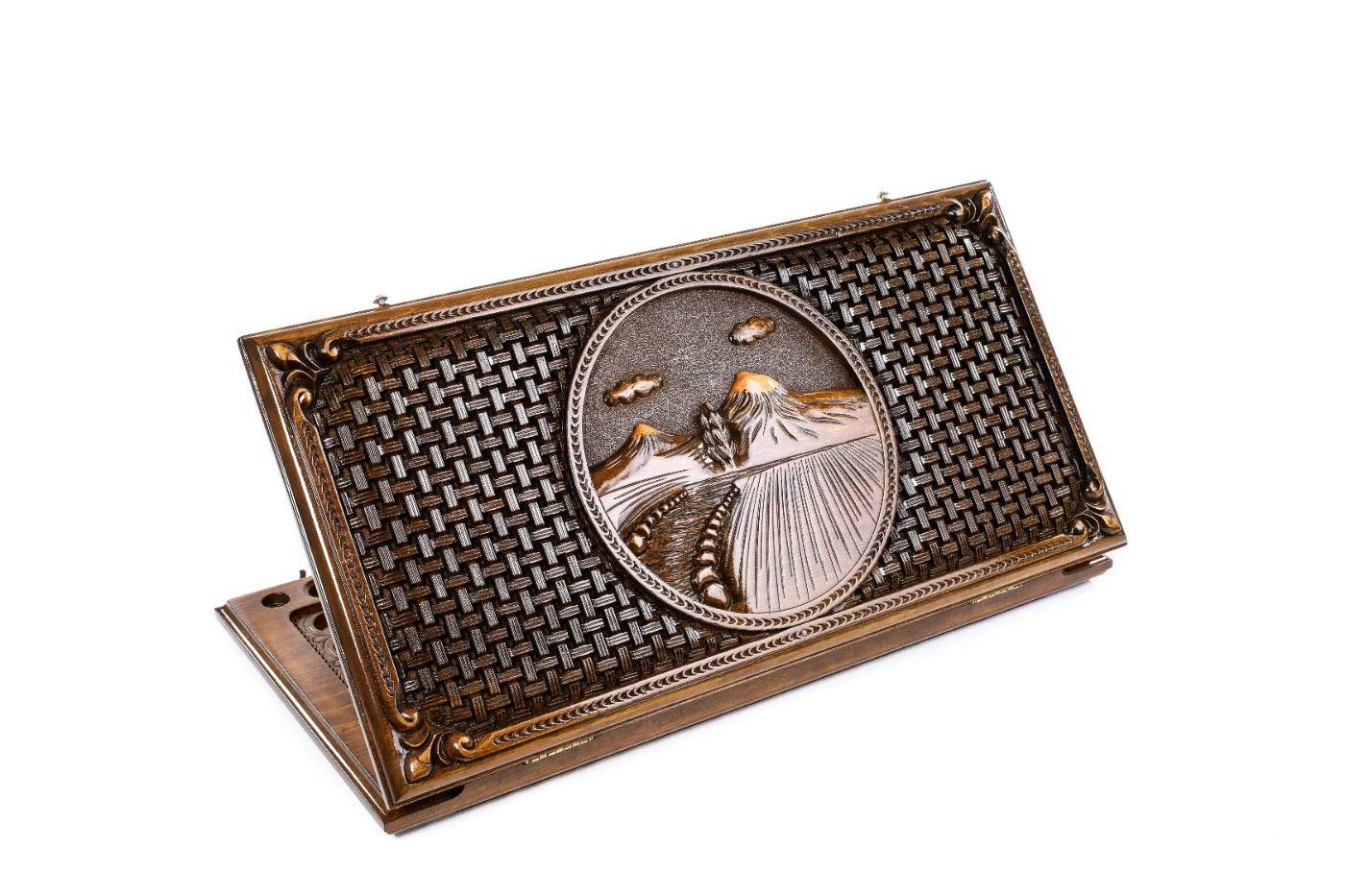 A frontal shot of the closed Mount Ararat classic backgammon board featuring the mountain relief and the hand-carved braid border.