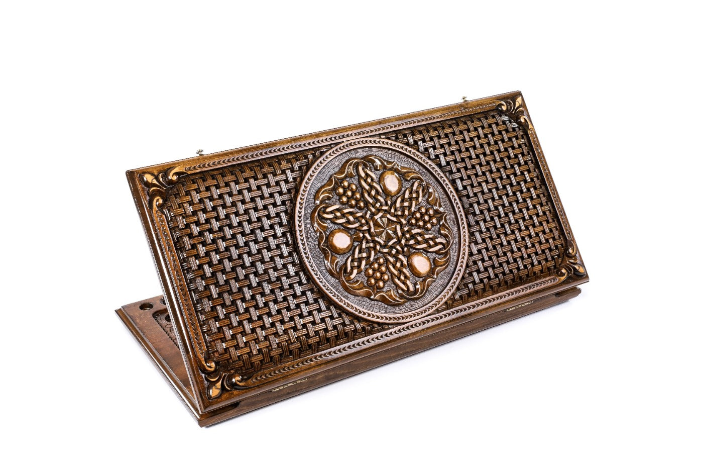 A frontal shot of the closed Pomegranate and Grapes backgammon board featuring the fruit relief and the braided border motif.