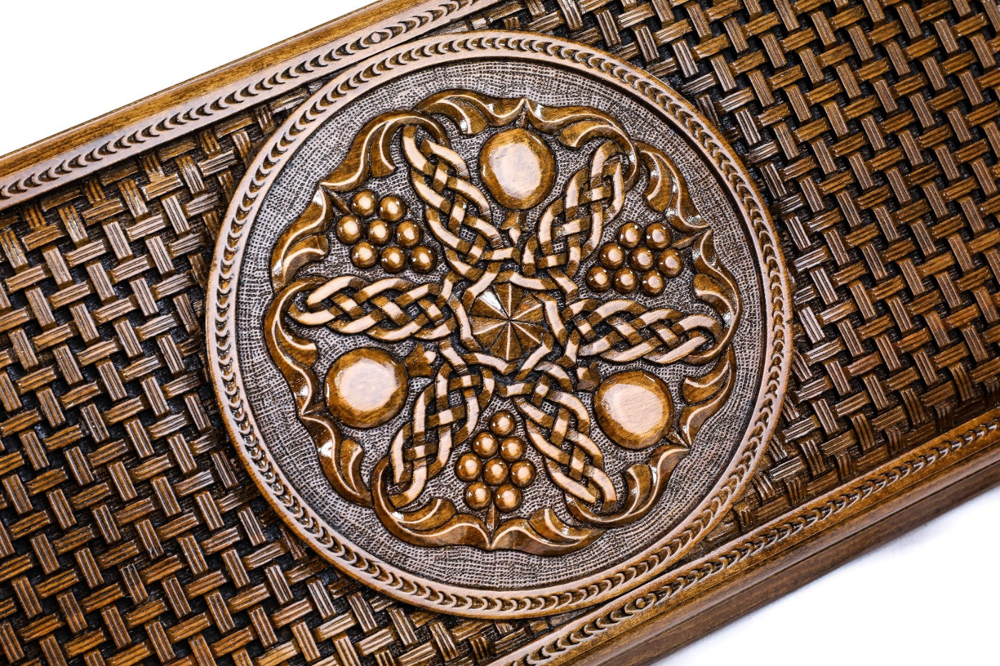 The interior view of the open Hrachya Ohanyan braid motif set highlighting the smooth wood finish and professional playing lanes.