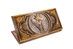 A frontal shot of the closed Eagle and Octagram backgammon board showing the detailed bird and star relief carving.