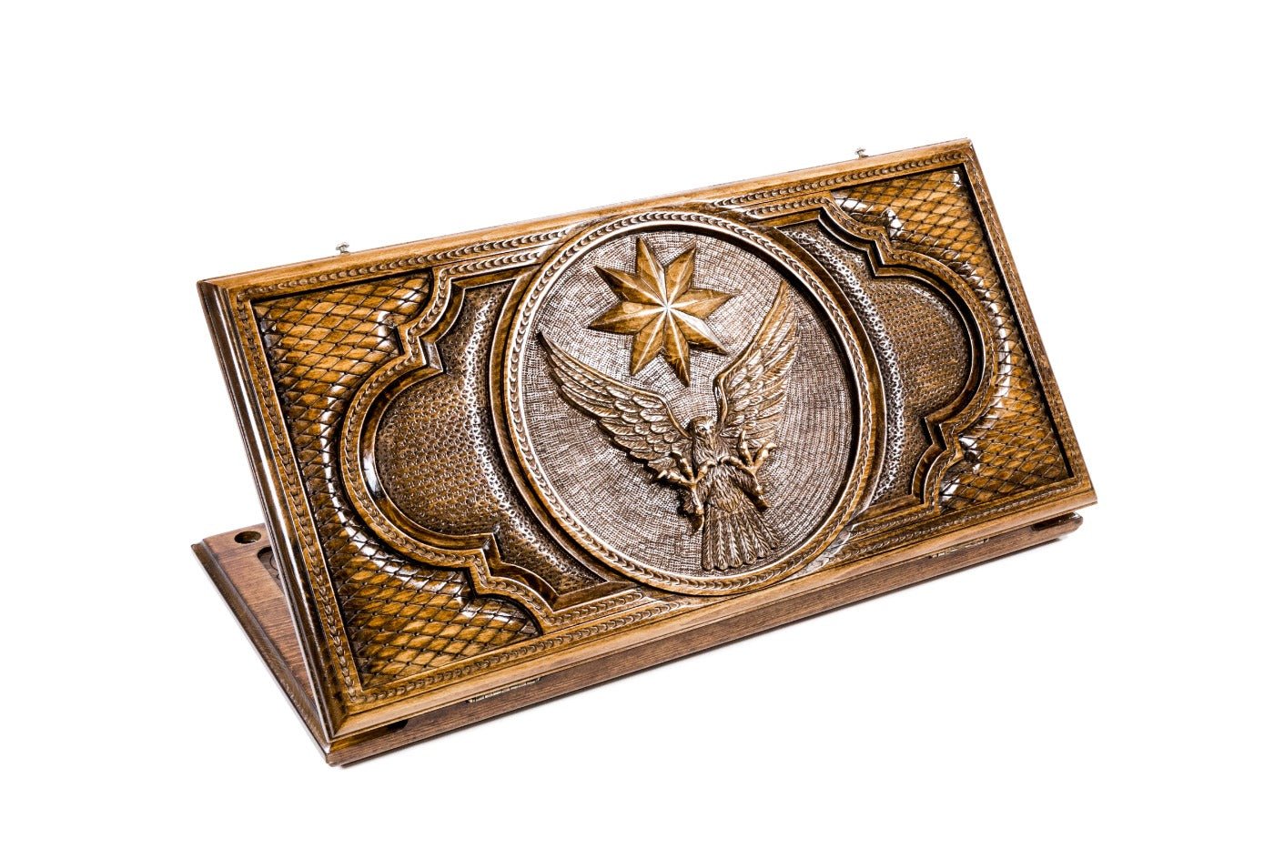 A frontal shot of the closed Eagle and Octagram backgammon board showing the detailed bird and star relief carving.