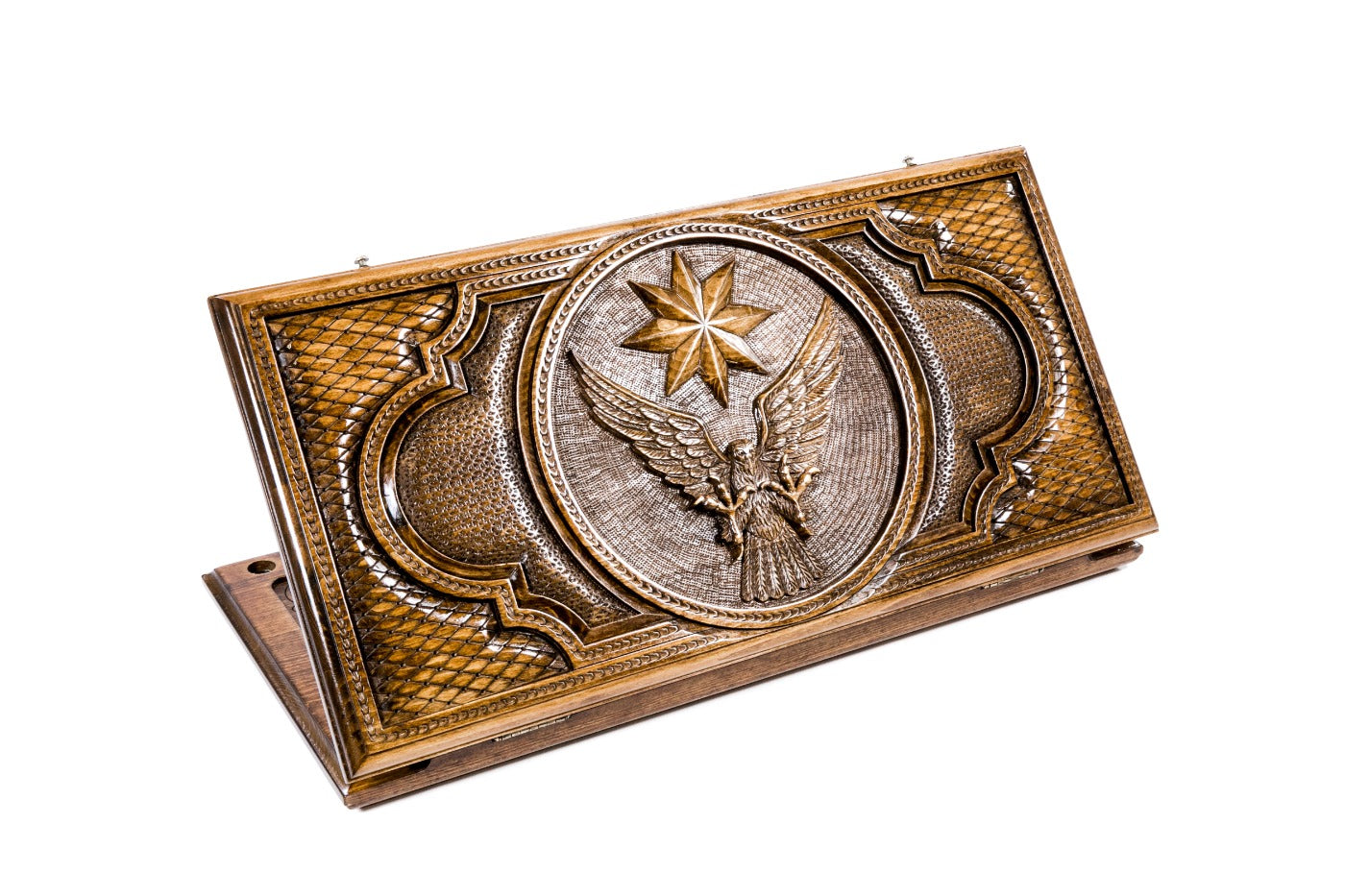 A frontal shot of the closed Eagle and Octagram backgammon board showing the detailed bird and star relief carving.
