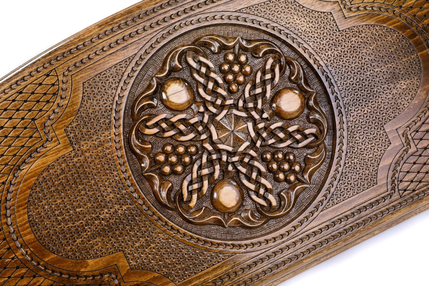 The interior view of the open Hrachya Ohanyan Arch-Style fruit motif board highlighting the smooth wood finish and professional pips.