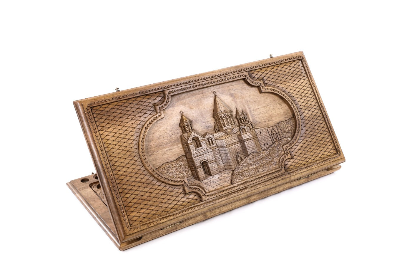 A frontal shot of the closed Etchmiadzin classic backgammon board showing the detailed cathedral relief carving.