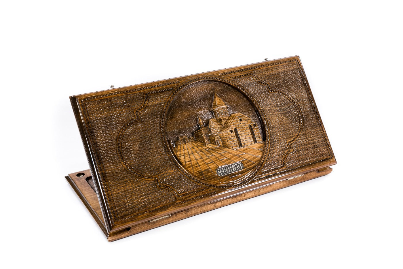 A frontal shot of the closed Geghard classic backgammon board showing the detailed monastery relief carving in solid wood.