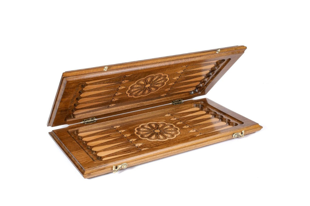Wooden backgammon set with carved ornamental detailing and pattern