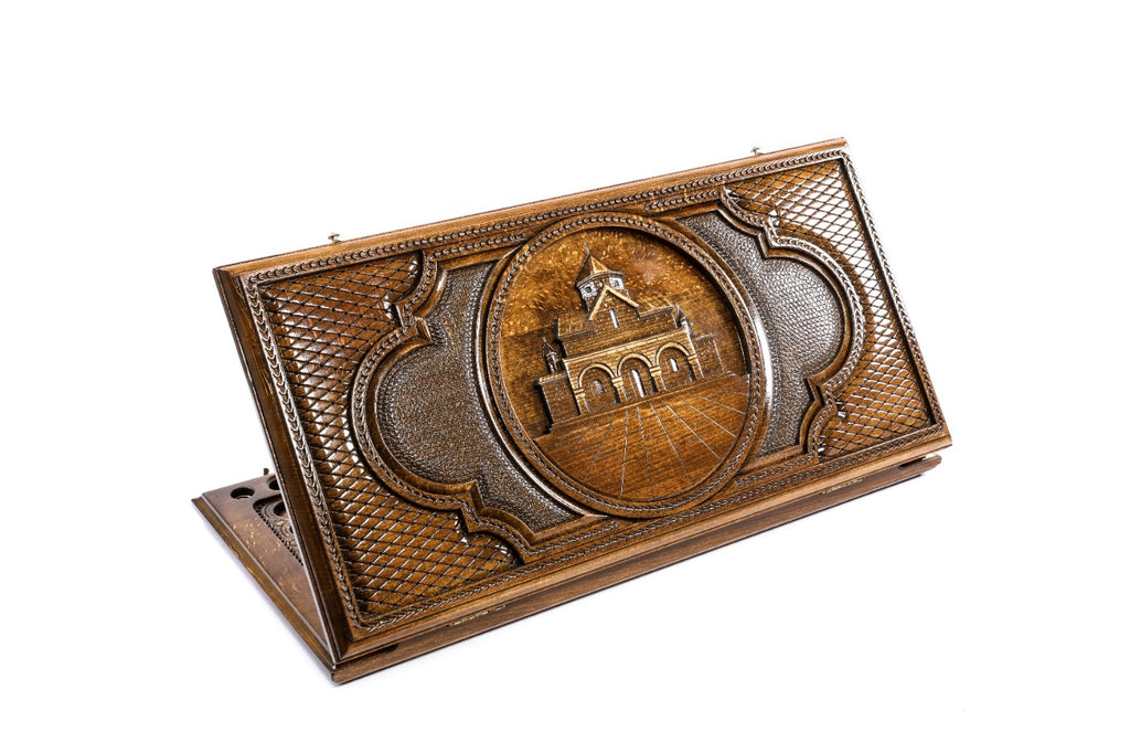 A frontal shot of the closed Church of St. Gayane classic backgammon board showing the deep-relief architectural carving.
