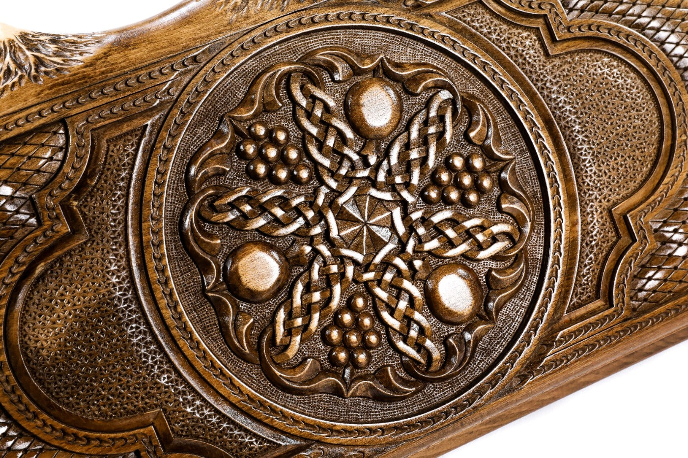 The interior view of the open Hrachya Ohanyan fruit motif board highlighting the smooth wood finish and professional pips.