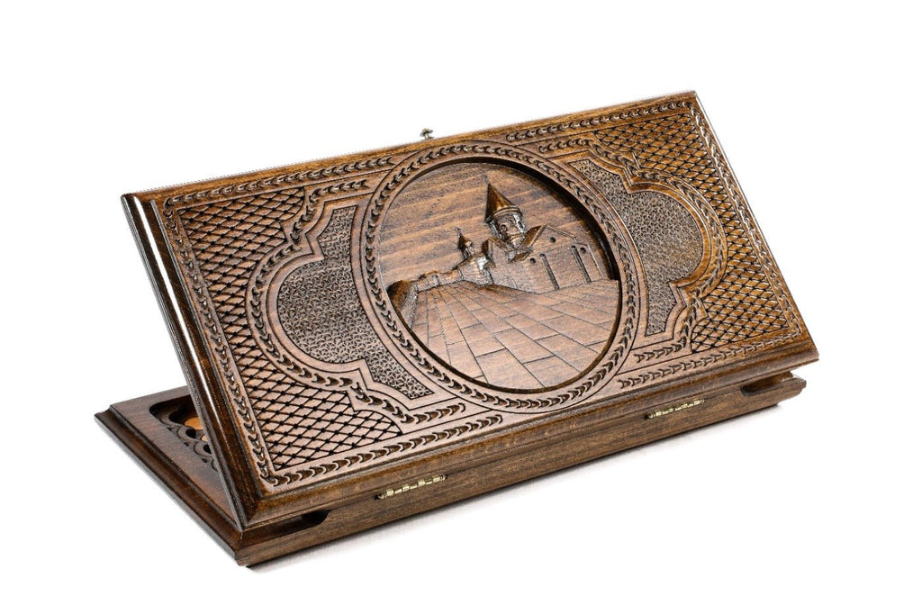 Closed Geghard Monastery backgammon board with detailed architectural relief carving.
