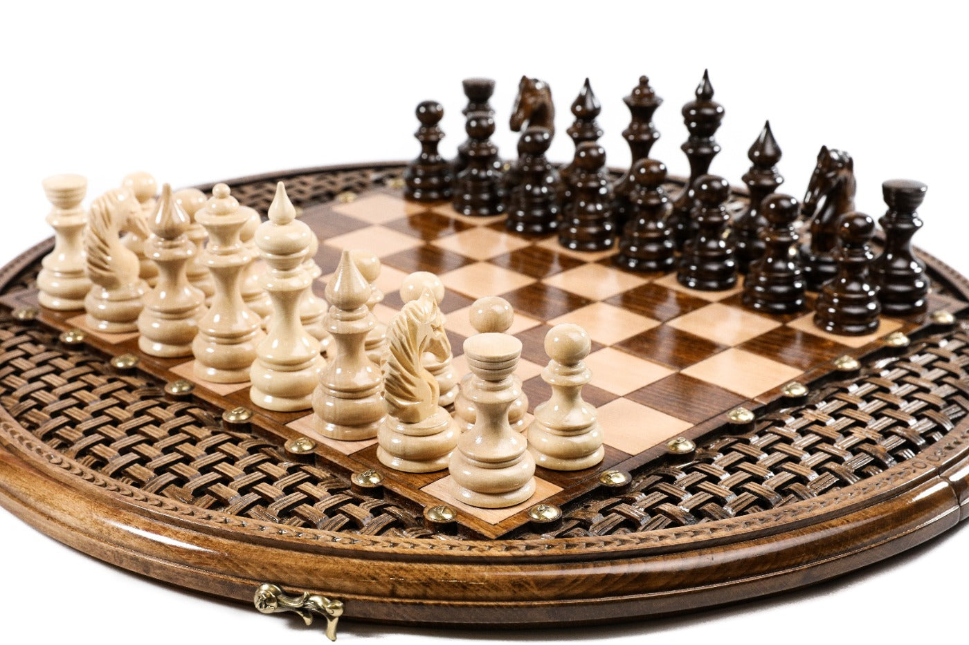 circular chess board with carved design and bronze accents