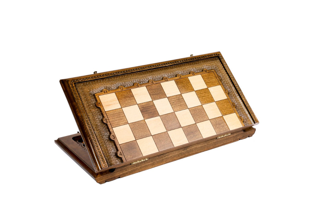 Wooden chess set closed and standing on edge, showing the hand-carved frame