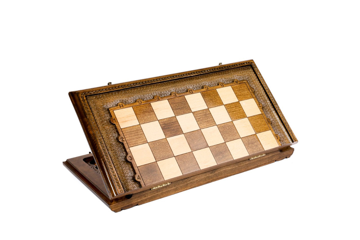 Wooden chess set closed and standing on edge, showing the hand-carved frame